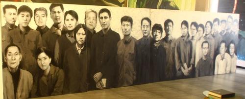 Painting by He Wenting with her books of poems on the table. (MInghui.org)