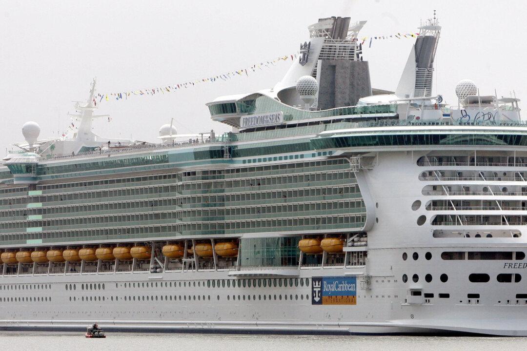 Cruise Ship Worker Appears to Wave Giant Fake Hand at Passengers Who Missed Boat