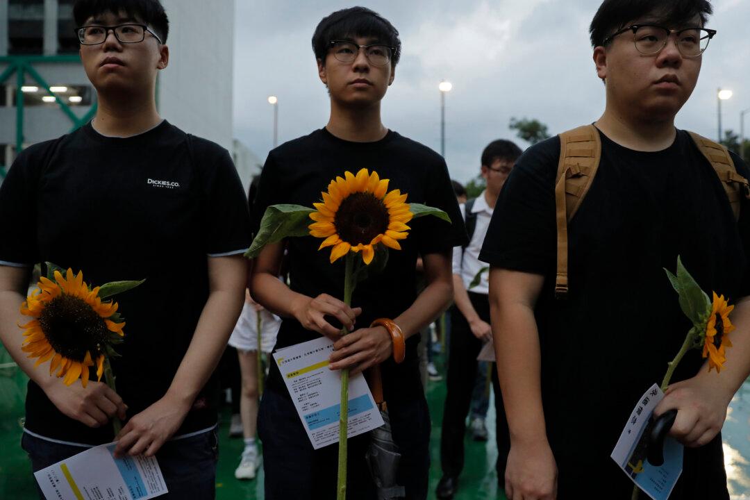 Parents of Dead Hong Kong Protester Urge Others to Carry On