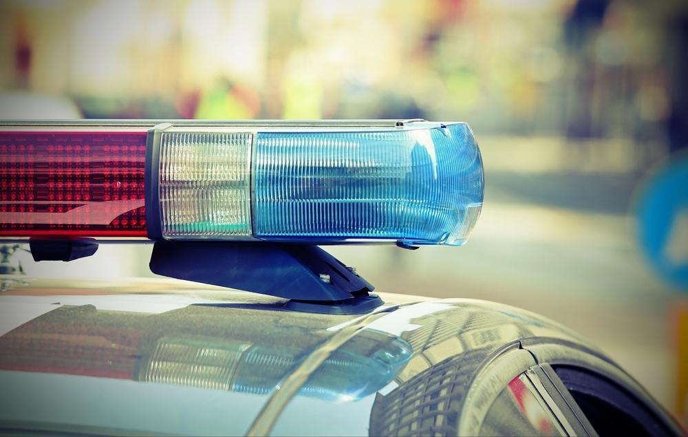 Illustration - Shutterstock | <a href="https://www.shutterstock.com/image-photo/flashing-lights-police-car-into-checkpoint-536219983?src=nWADfho_YAXBku5XFkPppA-1-5&studio=1">ChiccoDodiFC</a>