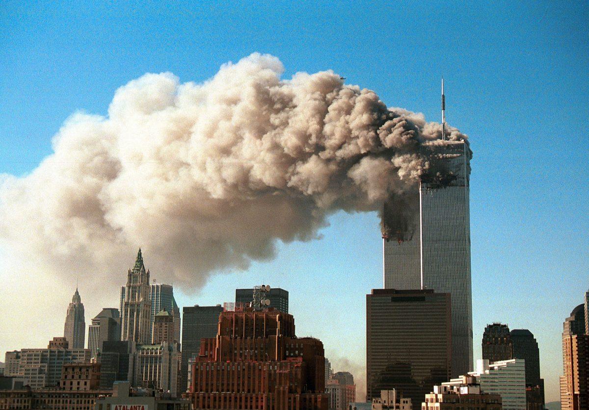 Smoke pours from the twin towers of the World Trade Center after they were hit by two hijacked airliners in a terrorist attack in New York City on Sept. 11, 2001. (Robert Giroux/Getty Images)
