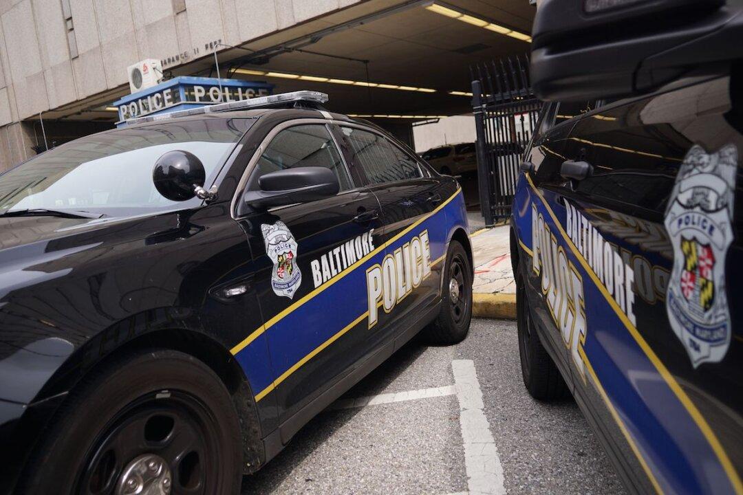 Video Shows Youngsters on E-scooters Beat, Rob Civilian Employee of the Baltimore Police