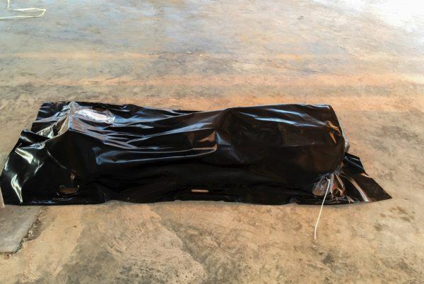 A body of a drowned migrant is seen on a coast some 60 miles east of Tripoli, Libya, on July 25, 2019. (Hazem Ahmed/AP Photo)