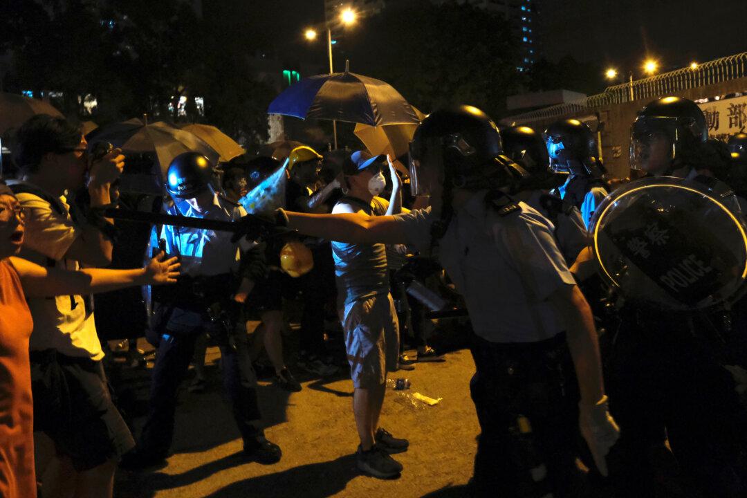 New Protest Erupts as Hong Kong Charges 44 Activists With Rioting