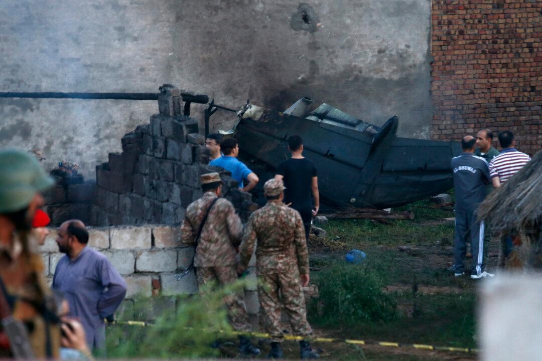 Pakistani Army Plane Crashes Into Homes, Killing at Least 18