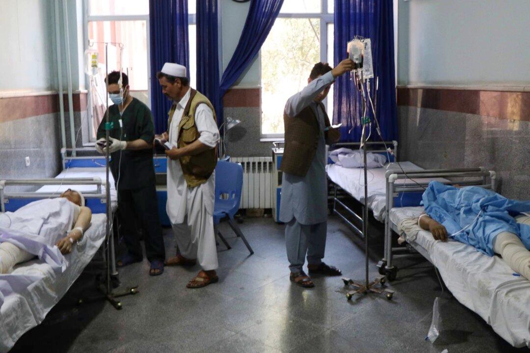 Roadside Bomb Hits Bus in Afghanistan, Killing at Least 35 and Wounding 27