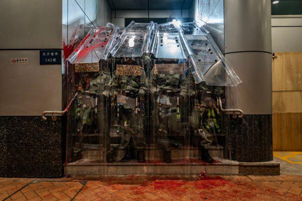 Riot police hold shields as they stand guard outside of the Mongkok Police Station during a standoff with protesters after an anti-government rally in on Sept. 1, 2019 in Hong Kong. (Anthony Kwan/Getty Images)