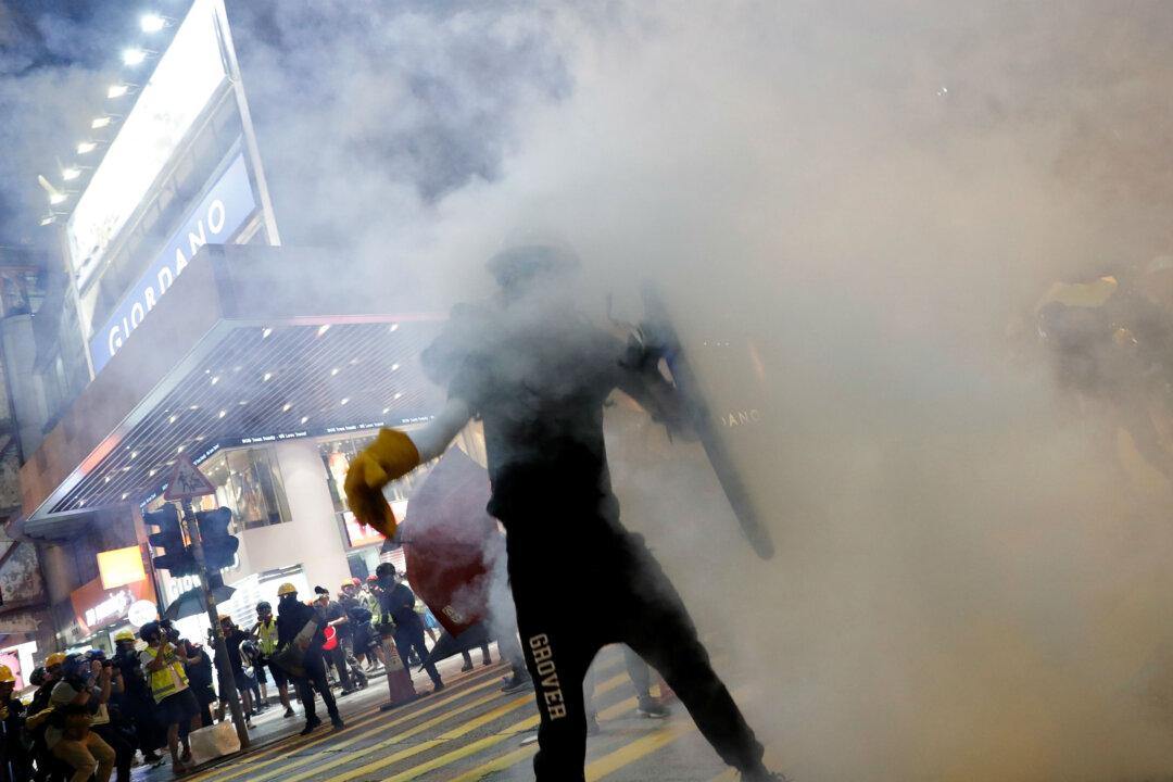 Hong Kong Police Fire Tear Gas as Protests Again Roil the City