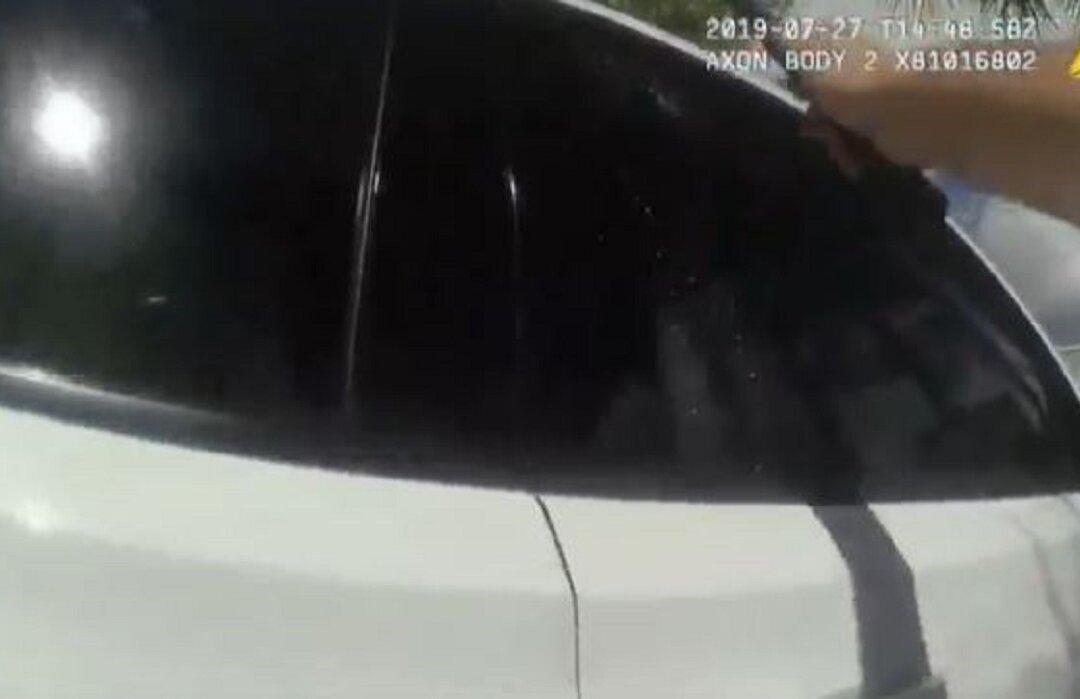 Video: Mother Locks Girl in Hot Car, Police Officer Shatters Window to Save the Baby