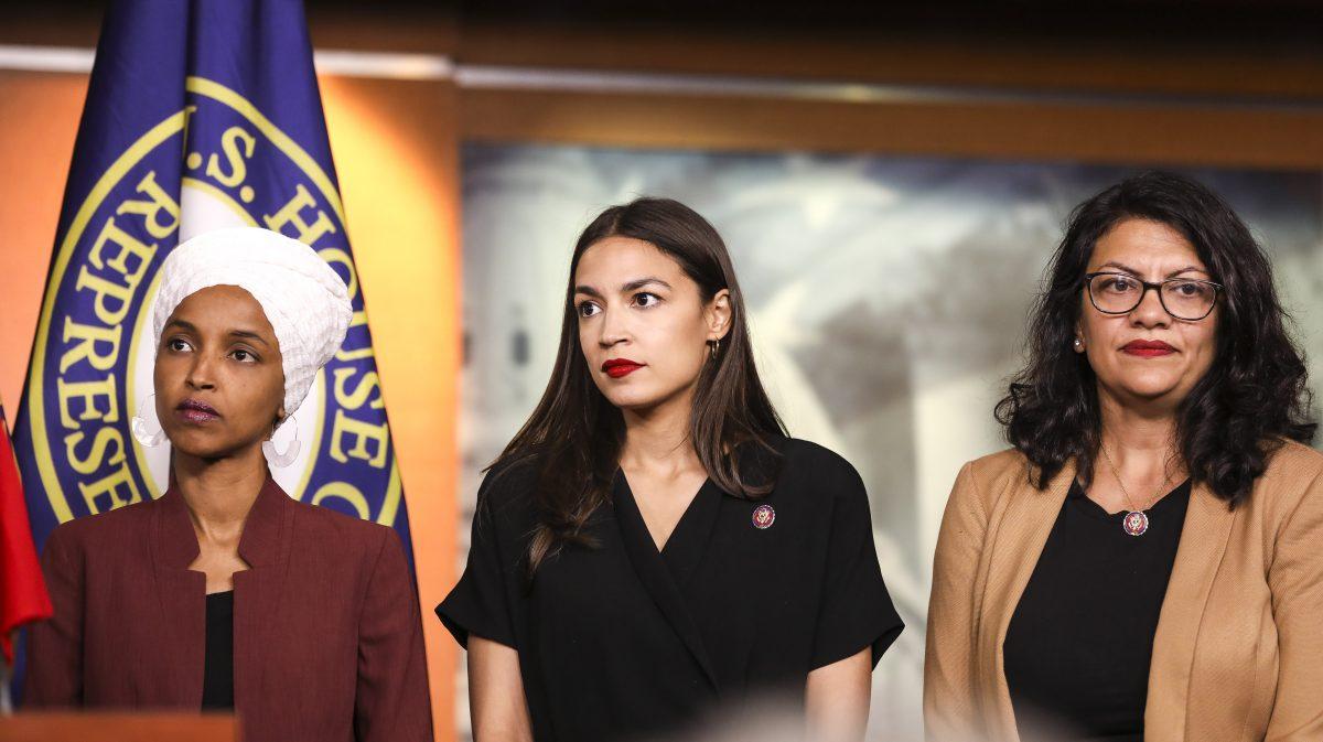 (L-R) Rep. Ilhan Omar (D-Minn.), Rep. Alexandria Ocasio-Cortez (D-N.Y.), and Rep. Rashida Tlaib (D-Mich.) speak at a press conference on the Capitol on July 15, 2019. (Holly Kellum/NTD)