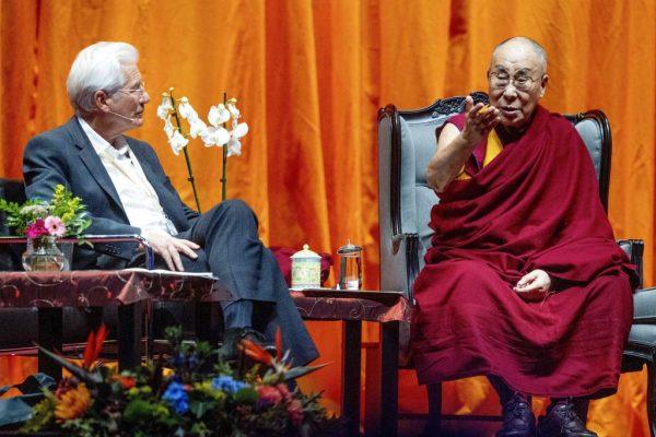 Tibetan spiritual leader Dalai Lama (R) speaks with American actor Richard Gere (L) during a lecture about the International Campaign for Tibet at Ahoy in Rotterdam, Netherlands, on Sept. 16, 2018. (Robin Utrecht/AFP/Getty Images)