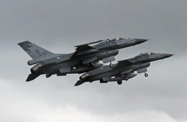 Two U.S.-made F-16 fighter jets in the air during a scramble takeoff at the Hualien air force base in Taiwan on Jan. 23, 2013. (Sam Yeh/AFP/Getty Images)