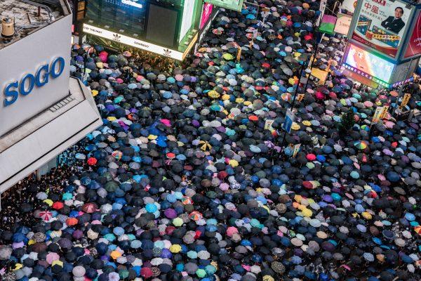 Protesters take part in a rally as they march on a street in Hong Kong, on Aug. 18, 2019. (Anthony Kwan/Getty Images)