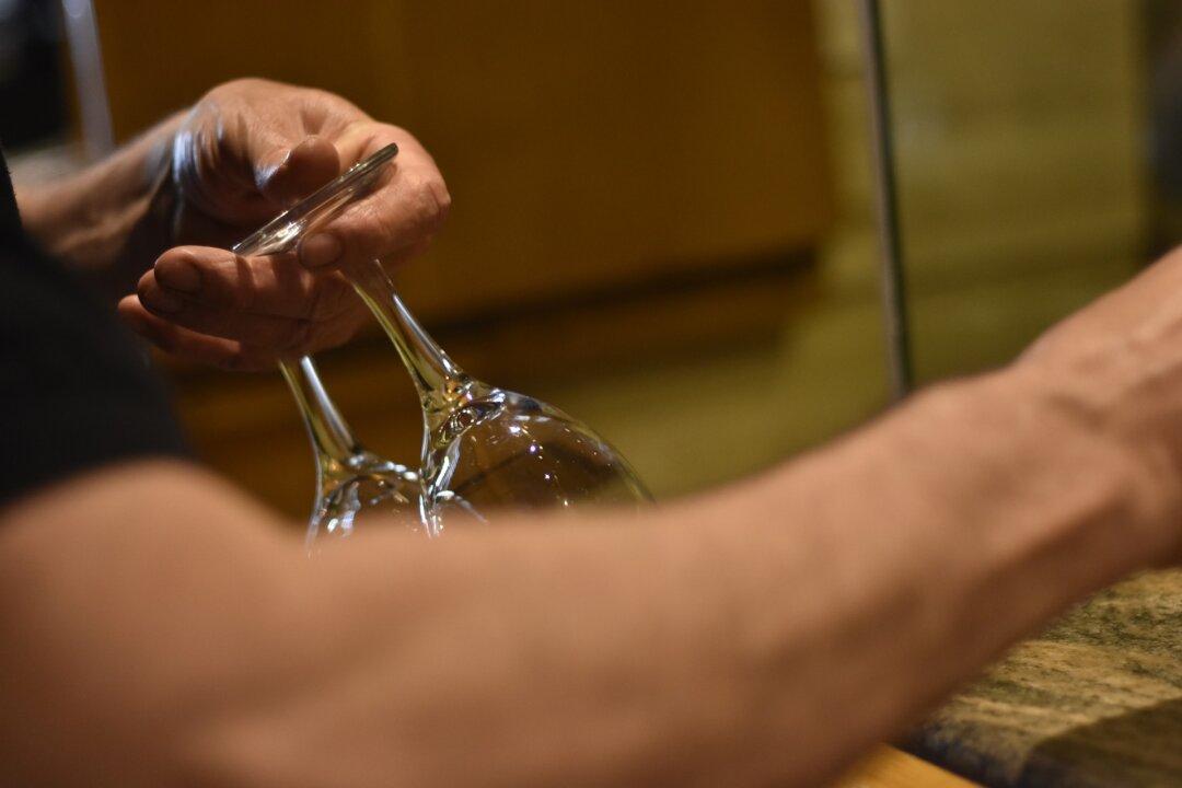Photograph of Young Waiter Sitting With 91-Year-Old Veteran During Break Goes Viral