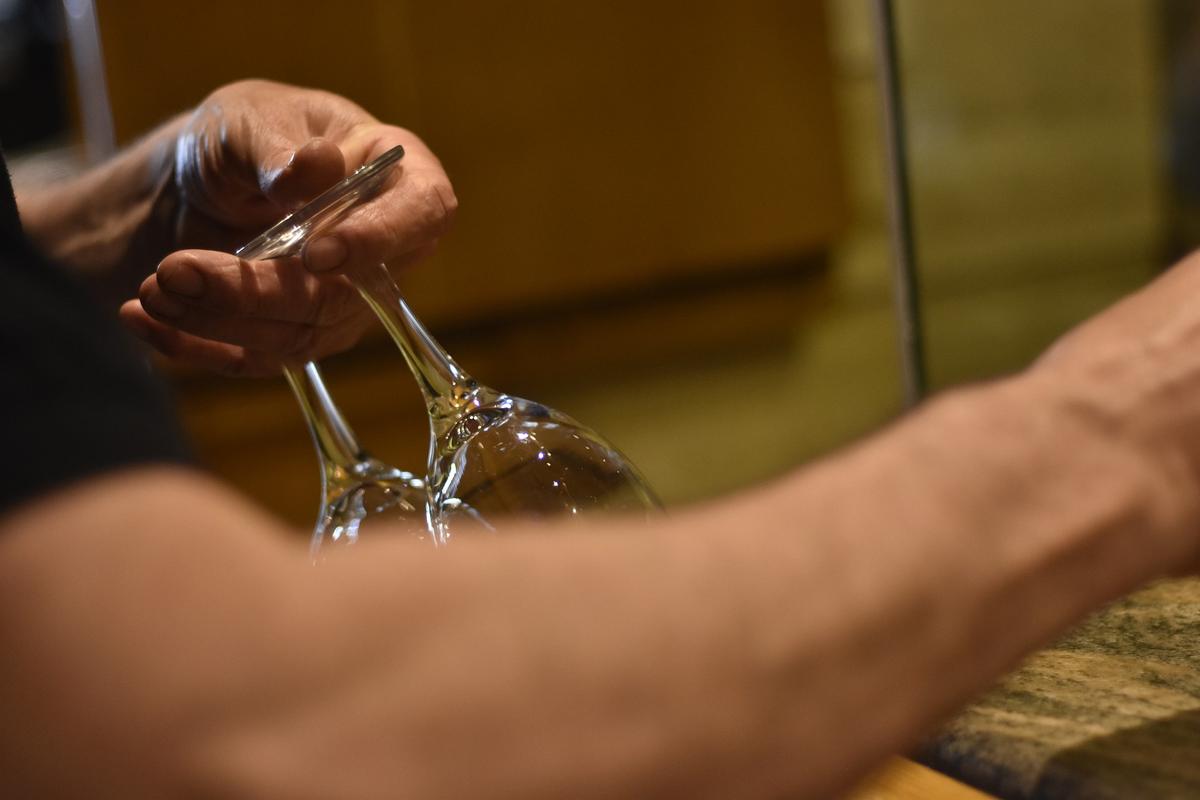 Photograph of Young Waiter Sitting With 91-Year-Old Veteran During Break Goes Viral