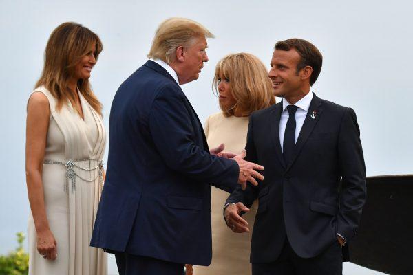 French President Emmanuel Macron (R) and his wife Brigitte Macron (2ndR) welcome President Donald Trump (2ndL) and US First Lady Melania Trump at the Biarritz lighthouse, southwestern France, ahead of a working dinner on Aug. 24, 2019, (Nicholas Kamm/AFP/Getty Images)