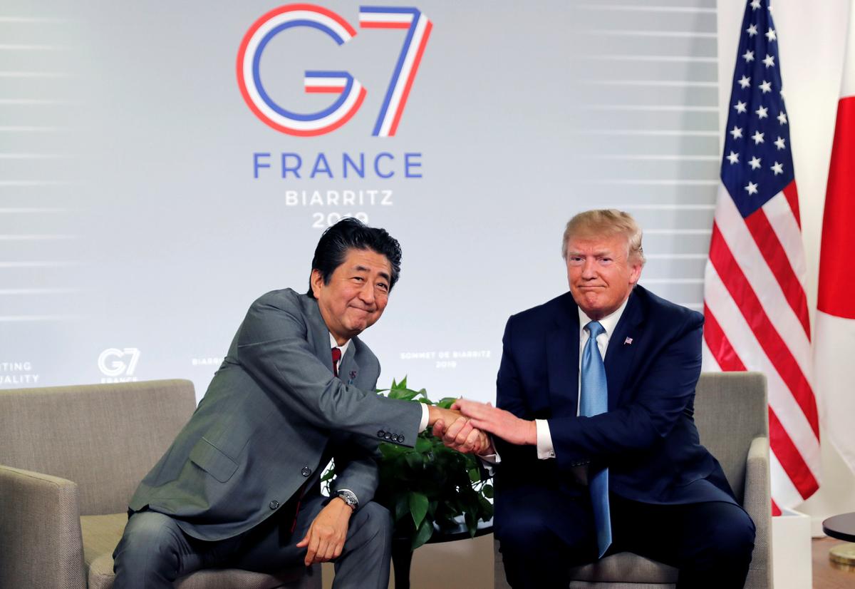 U.S. President Donald Trump and Japan's Prime Minister Shinzo Abe shake hands as they attend a bilateral meeting during the G7 summit in Biarritz, France, on Aug. 25, 2019. (Carlos Barria/Reuters)