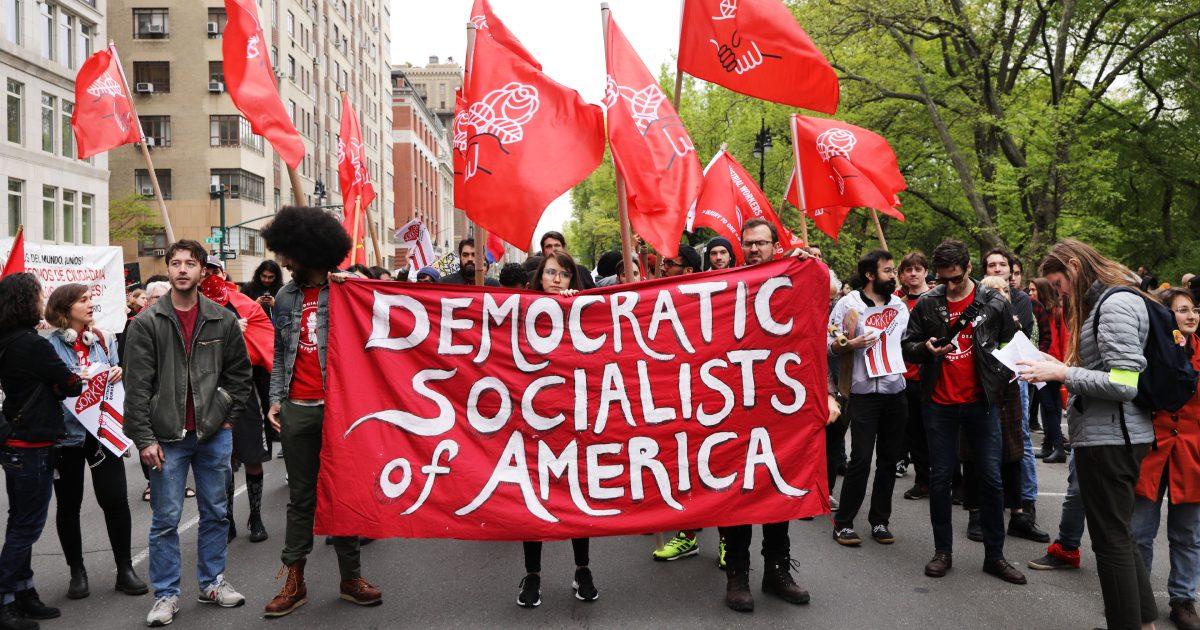 Members of the Democratic Socialists of America gather outside of a Trump-owned building in New York City on May 1, 2019. (Spencer Platt/Getty Images)