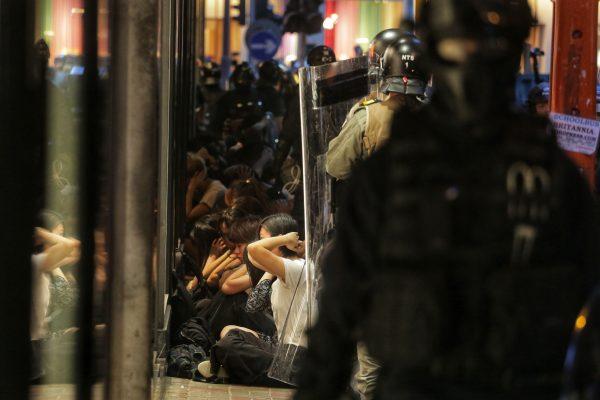Riot police isolate and search protesters near an entrance to the Central MTR subway station in Hong Kong on Sept. 8, 2019. (Vivek Prakash/AFP/Getty Images)