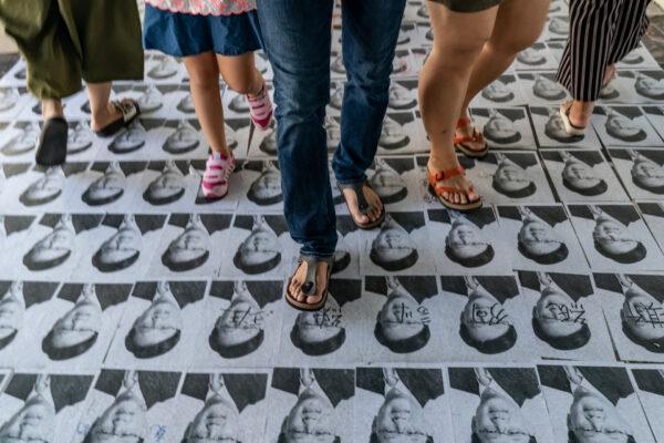 Photographs of pro-China lawmaker Junius Ho are seen on a pedestrian bridge outside Yeun Long MTR station in Hong Kong on Sept. 21, 2019. (Anthony Kwan/Getty Images)