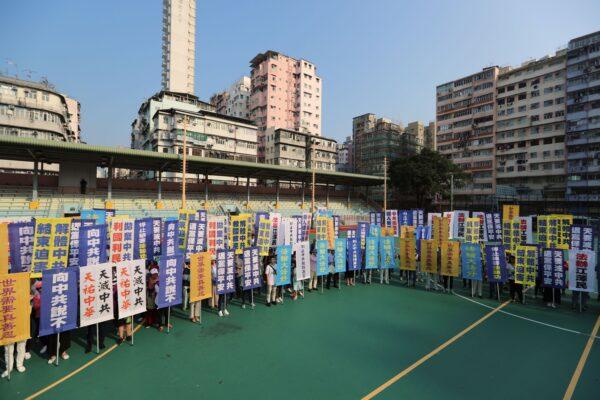 Members of the Falun Gong spiritual group, a group banned in mainland China, gather to protest at a playground in the Sham Shui Po district in Hong Kong on Oct. 1, 2019, as intense protests were expected across the city on the 70th anniversary of communist China's founding. (May James/AFP/Getty Images)