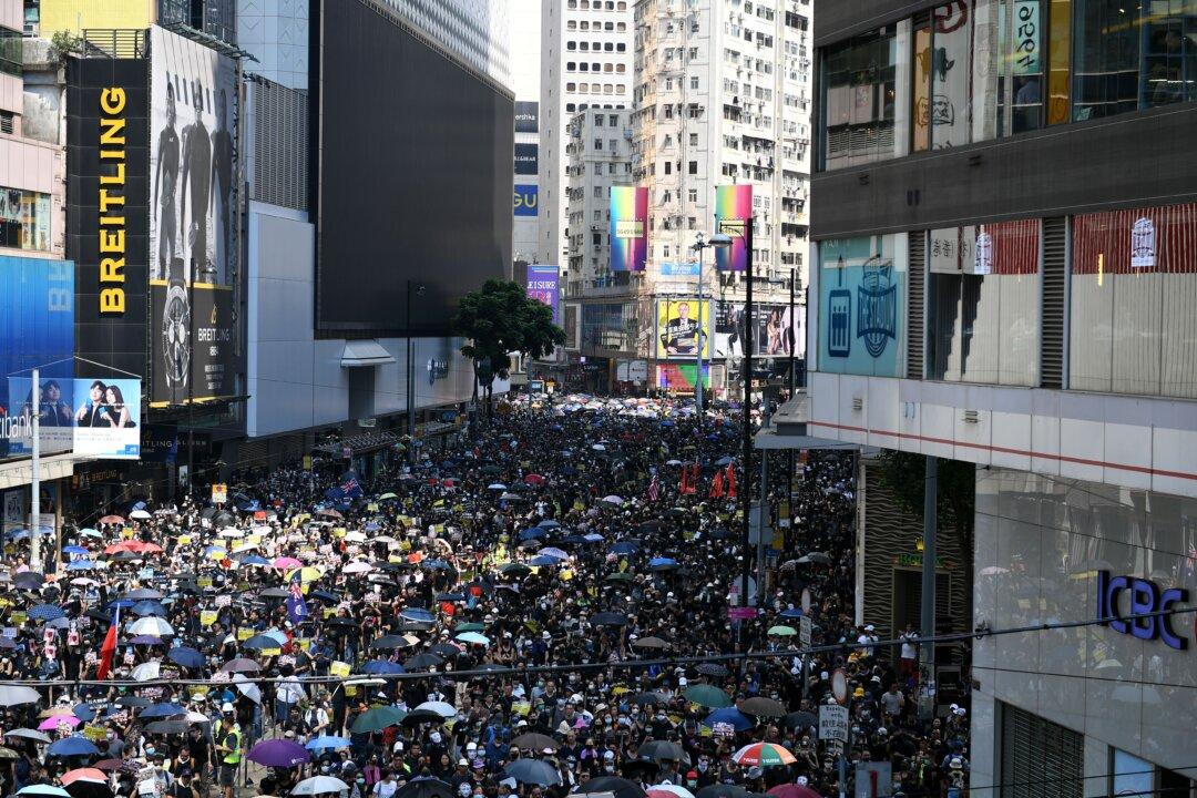 ‘We Are Mourning:’ Thousands of Hongkongers March on Communist Party Anniversary Despite Ban