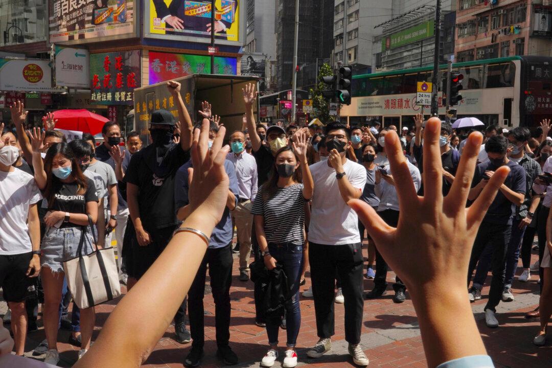 Thousands Protest Mask Ban as Hong Kong Leader Toughens Stance