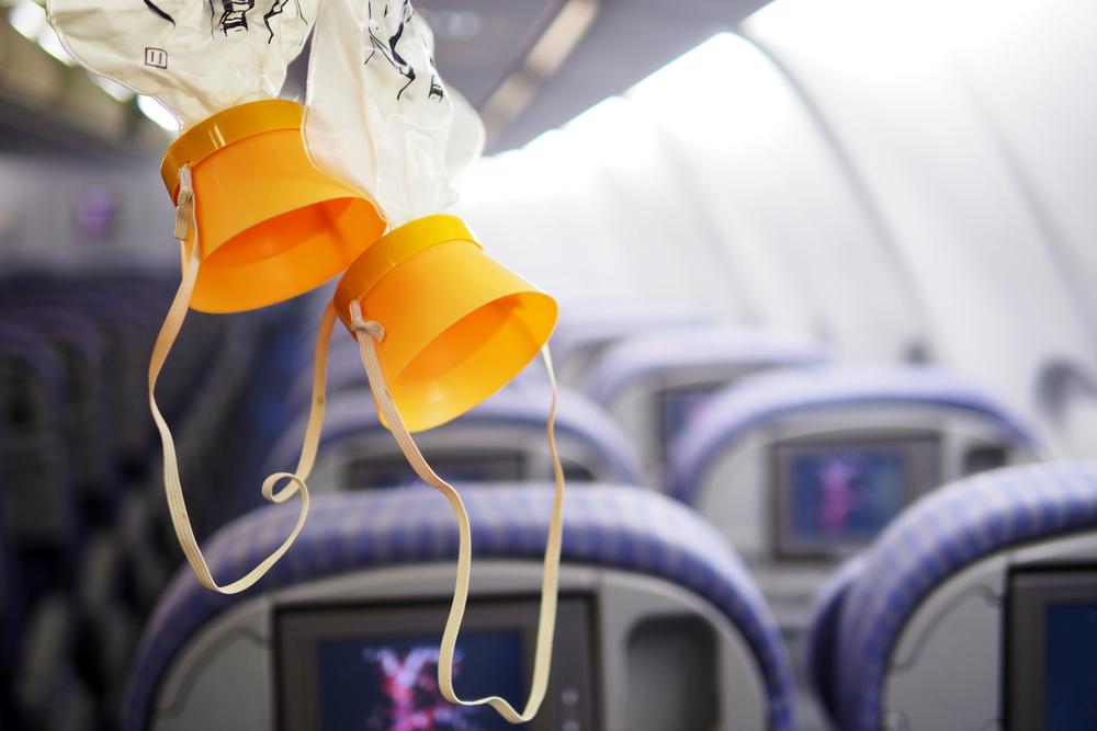 Illustration - Shutterstock | <a href="https://www.shutterstock.com/image-photo/cabin-oxygen-mask-drop-ceiling-486573790?src=OCm1-lMlVW1KTQoW0-n9nw-1-0">litabit</a>