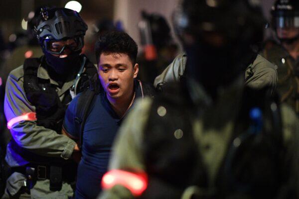 Police detain a protester during a rally in Hong Kong on Oct. 14, 2019. (Mohd RASFAN/AFP via Getty Images)