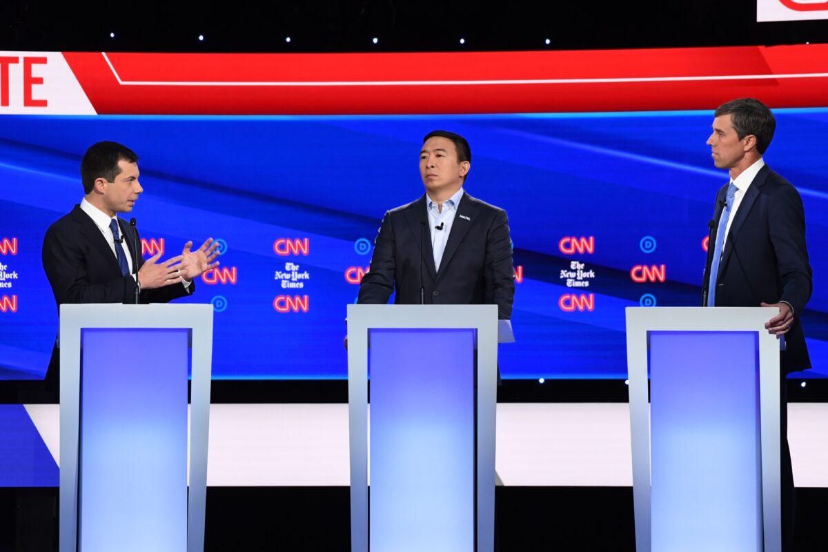 Democratic presidential hopefuls South Bend Mayor Pete Buttigieg, left, entrepreneur Andrew Yang, center and former Rep. Beto O'Rourke participate of the fourth Democratic primary debate of the 2020 presidential campaign season co-hosted by The New York Times and CNN at Otterbein University in Westerville, Ohio on Oct. 15, 2019. (Saul Loeb/AFP via Getty Images)