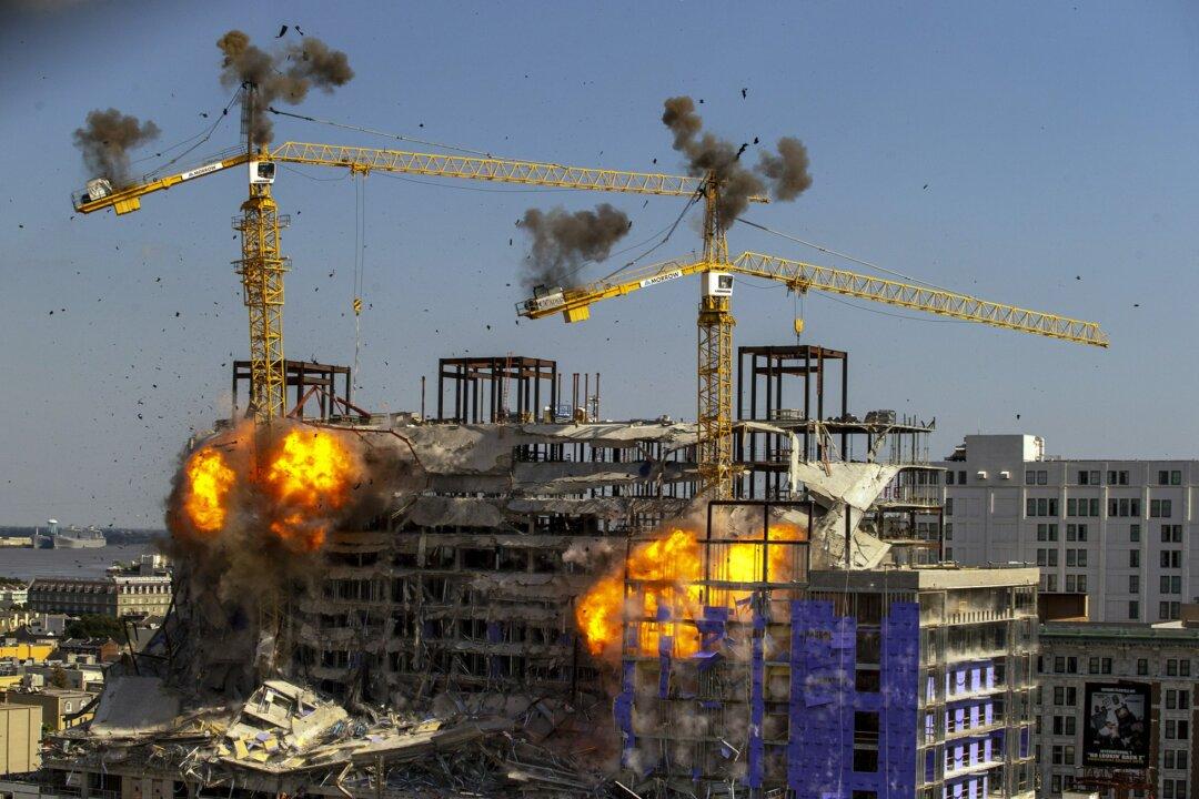 2 Leaning Cranes Toppled at Partly Collapsed New Orleans Hotel