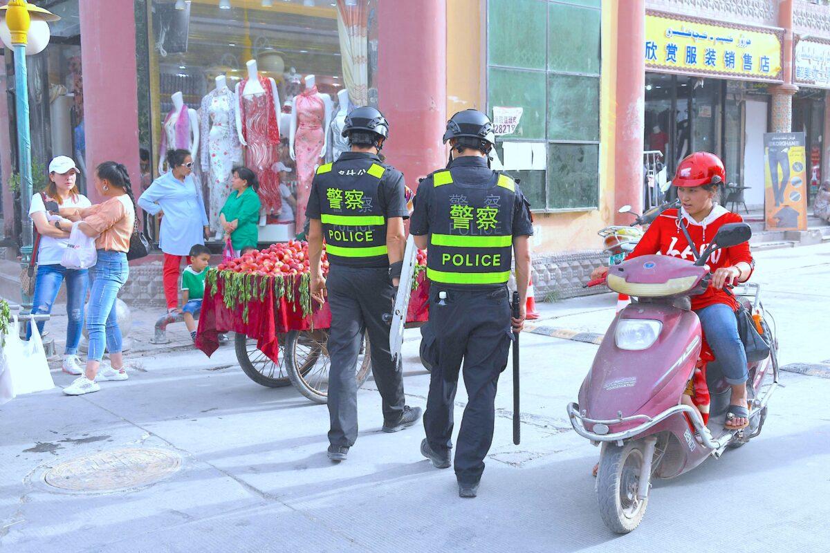 Police officers patrolling in Kashgar in China's western Xinjiang region on June 4, 2019. The recent destruction of dozens of mosques in Xinjiang highlights the increasing pressure Uyghurs and other ethnic minorities face in the heavily-policed region. (Greg Baker/AFP/Getty Images)