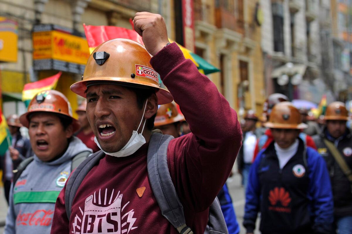 Miners march to support the Movimiento Al Socialismo (MAS) party and its leader Bolivian President Evo Morales in La Paz on Oct. 28, 2019. (JORGE BERNAL/AFP via Getty Images)