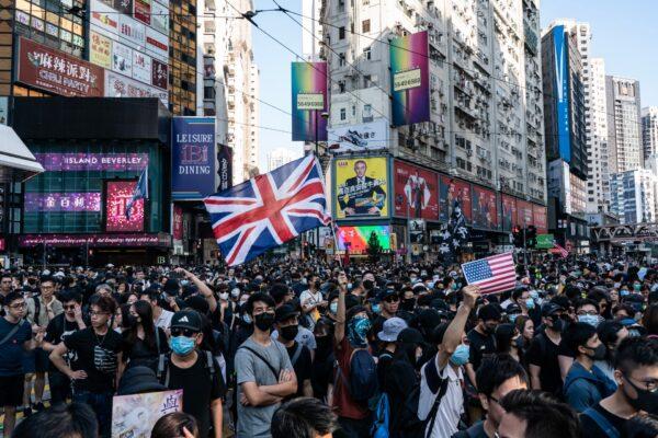 Pro-democracy protesters march on a street as they take part in a demonstration in Causeway Bay district in Hong Kong, on Nov. 2, 2019. (Anthony Kwan/Getty Images)