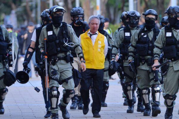 Police arrested political candidate Richard Chan at Victoria Park in Hong Kong, on Nov. 2, 2019. (Sung Pi Lung/The Epoch Times)
