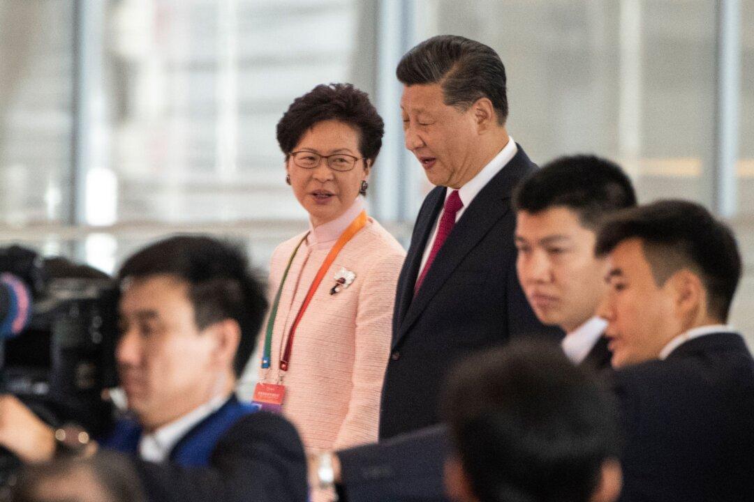 In Rare Meeting, China’s Xi Backs Carrie Lam’s Handling of Hong Kong Protests