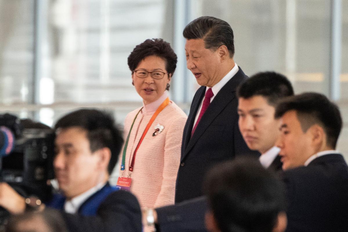 In Rare Meeting, China’s Xi Backs Carrie Lam’s Handling of Hong Kong Protests