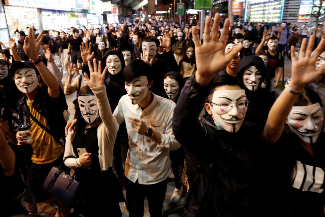 Masked Protesters Take to Hong Kong Streets