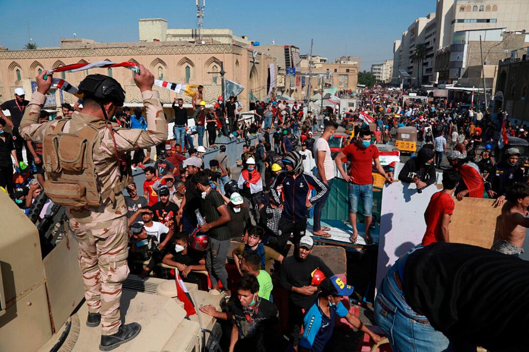 Iraq Protesters Storm Baghdad Bridge, Medic Killed