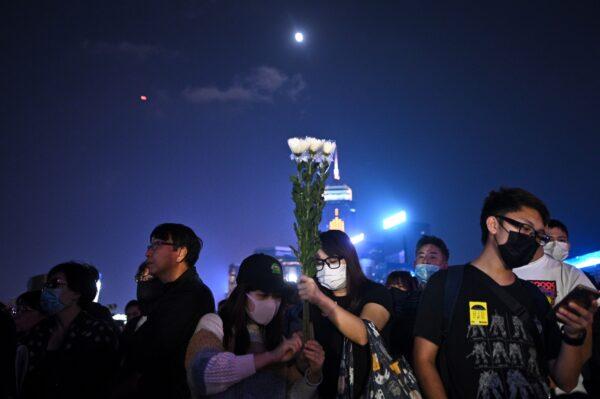 People attend a prayer rally in Hong Kong's Tamar Park in memory of 22-year-old university student Alex Chow in Hong Kong, on Nov. 9, 2019. (Philip Fong/AFP via Getty Images)