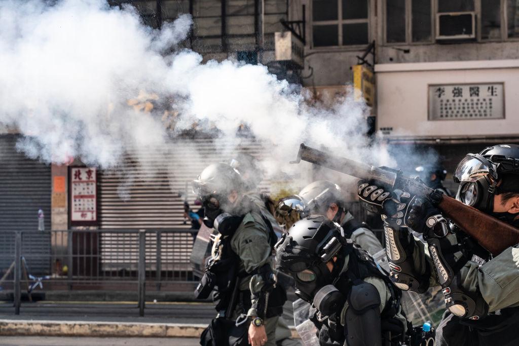 Riot police charge as they fire tear gas on a street to disperse protesters in Hong Kong on Nov.11, 2019. (Anthony Kwan/Getty Images)