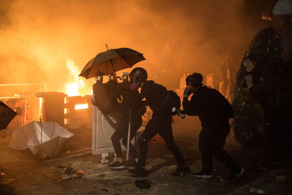 Protesters gather during clashes with police at the Chinese University of Hong Kong (CUHK) in Hong Kong, on Nov. 12, 2019. (Dale De La Rey/AFP via Getty Images)