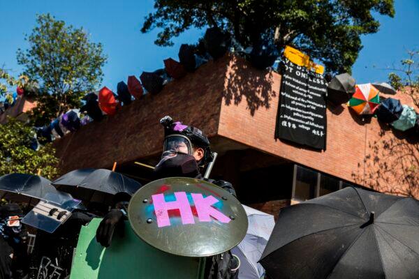 Protesters stand off with the police outside Hong Kong Polytechnic University in Hong Kong on Nov. 17, 2019. (Isaac Lawrence/AFP via Getty Images)