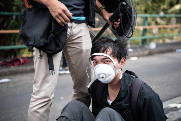Police arrest protesters at Hong Kong Polytechnic University in Hong Kong on Nov. 18, 2019. (Laurel Chor/Getty Images)