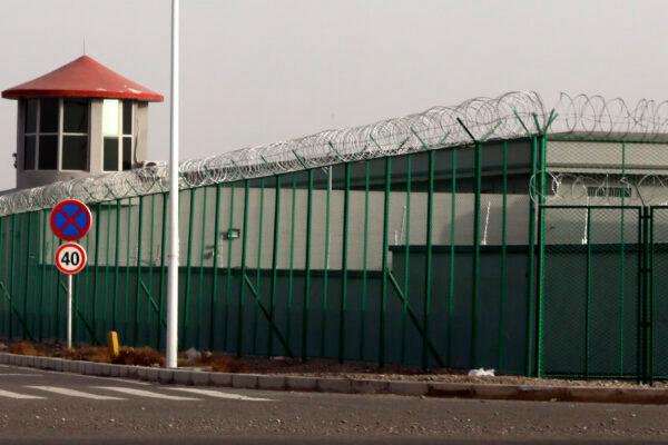 A guard tower and barbed wire fences are seen around a section of the Artux City Vocational Skills Education Training Service Center in Artux in western China's Xinjiang region on Dec. 3, 2018. (AP Photo/File)