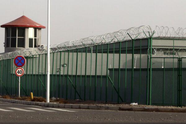 A guard tower and barbed wire fences are seen around a section of the Artux City Vocational Skills Education Training Service Center for Uyghurs, in Artux in Xinjiang region, China, on Dec. 3, 2018. (AP Photo)