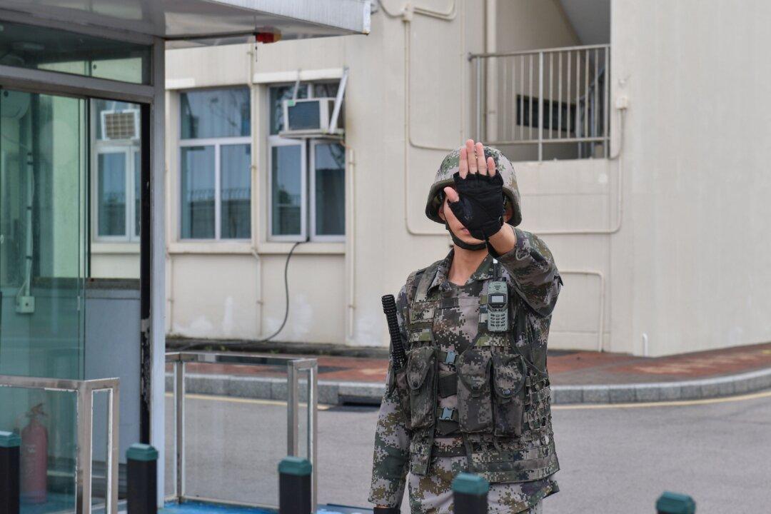 Chinese Colonel at Hong Kong Army Garrison Got Rank Through Bribery: Insider