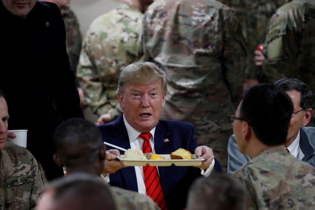 Trump Enjoys Belated Thanksgiving Dinner After Visiting Troops in Afghanistan