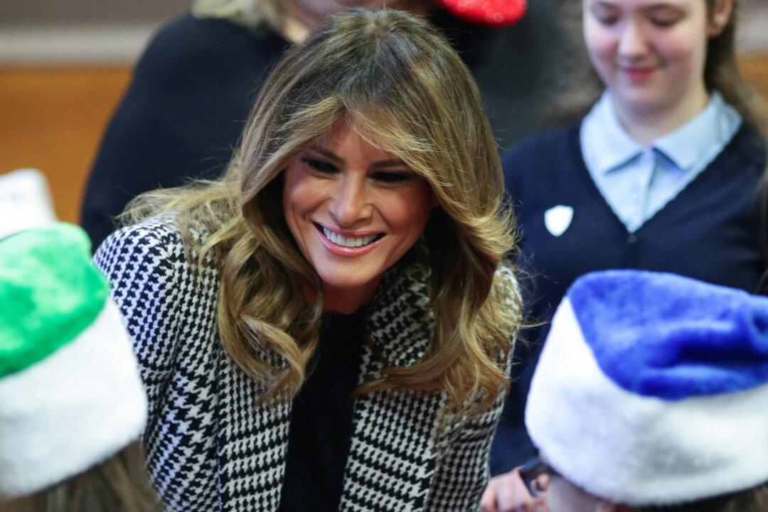 Melania Trump Hands Out Christmas Presents to London Children