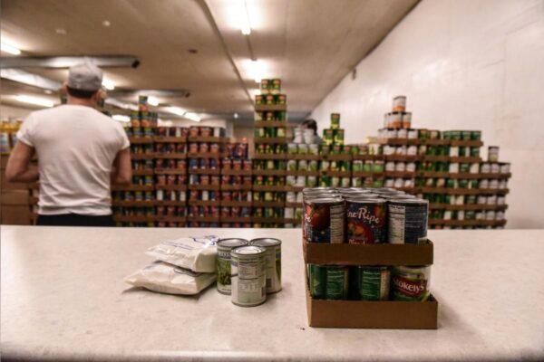 A worker places packaged food onto a counter inside of a food distribution center on the Cheyenne River Indian Reservation in Eagle Butte, South Dakota, on Jan. 25, 2019. (Stephanie Keith/File Photo/Reuters)